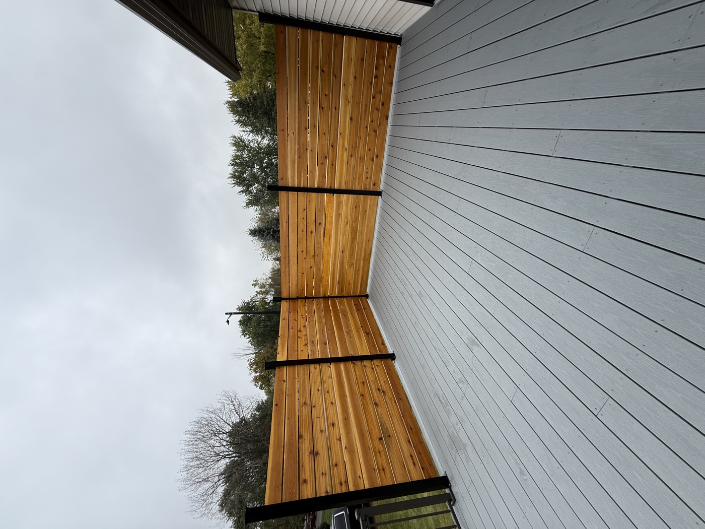 Composite deck with cedar privacy screen